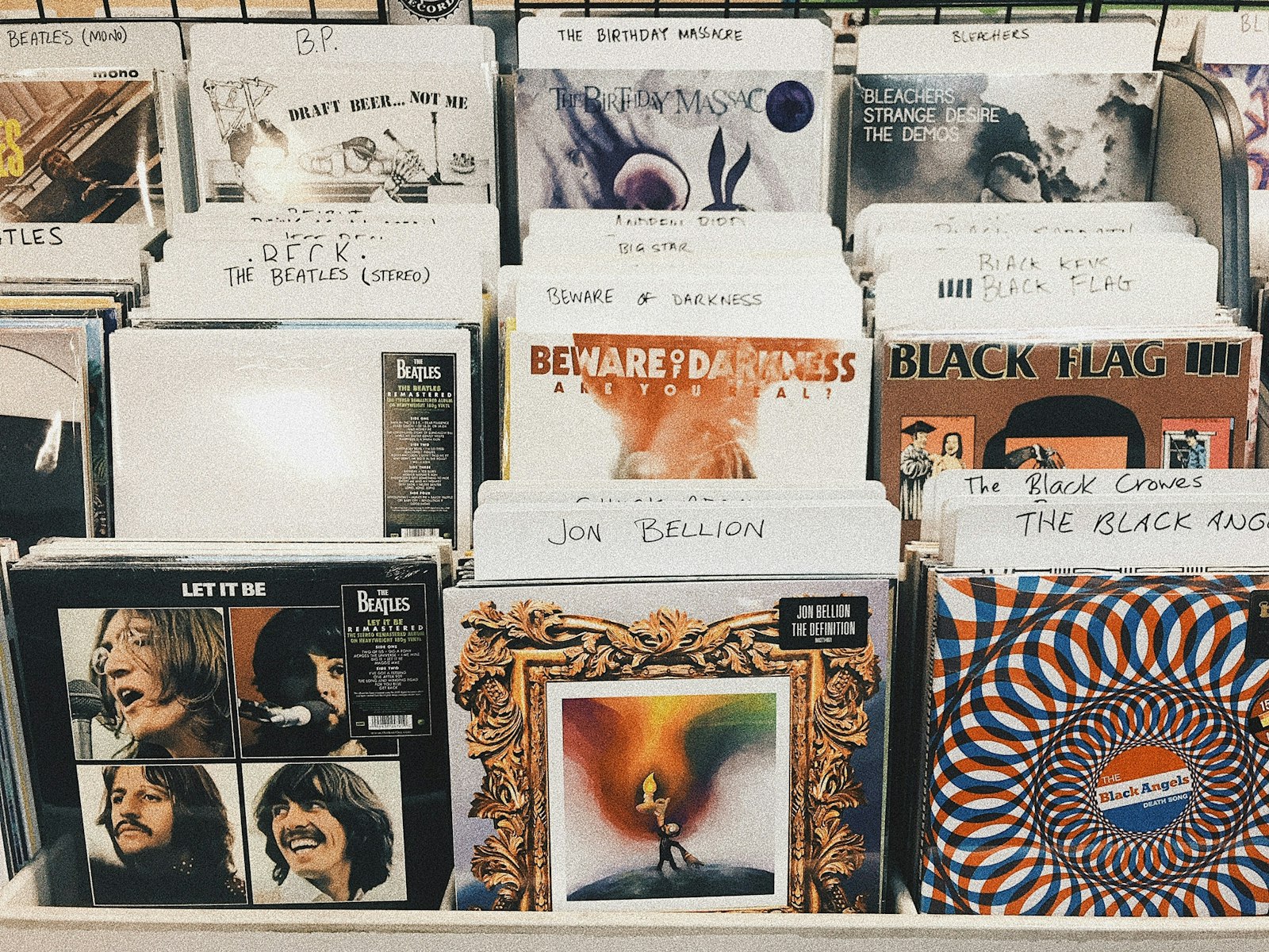 A pile of second-hand vinyl record sleeves ready for browsing