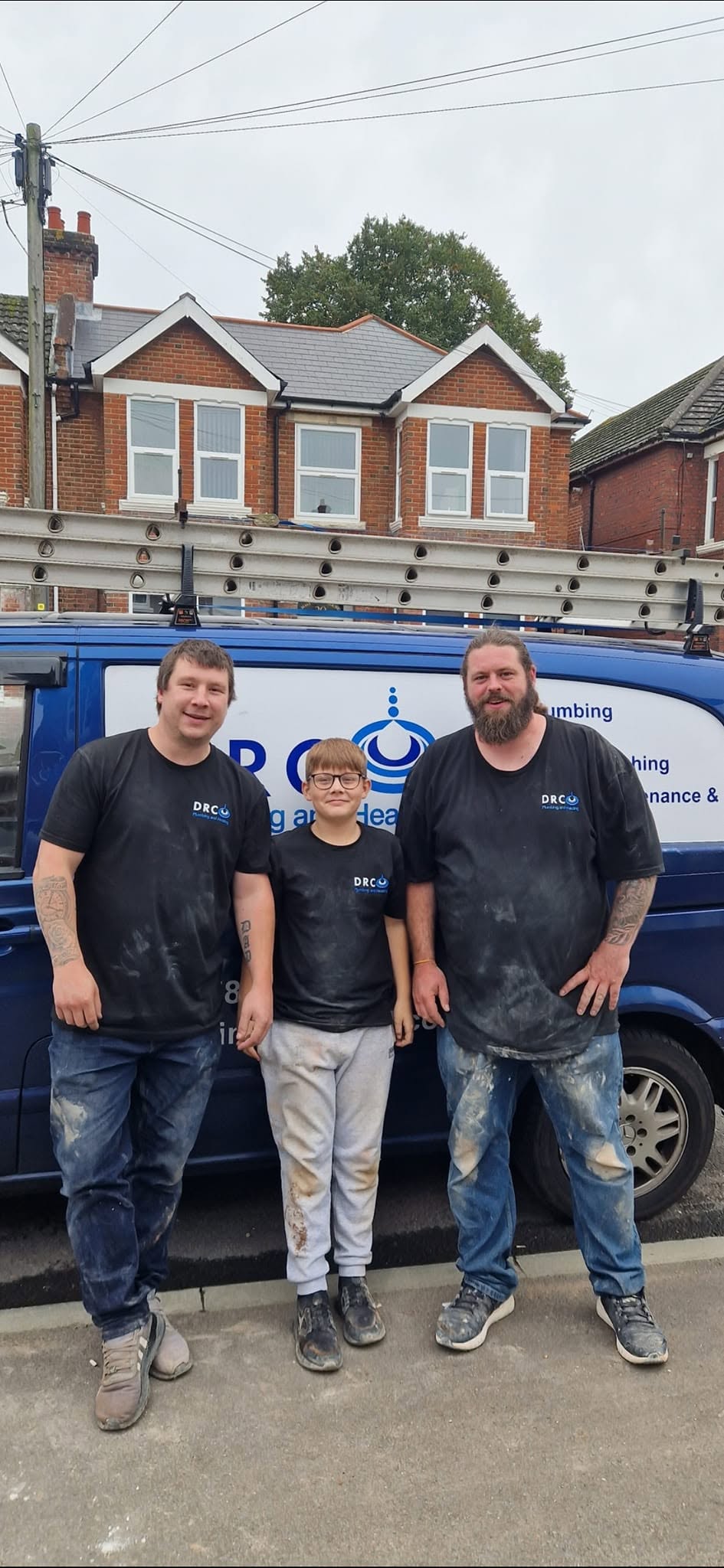 The DRC Plumbing and Heating team standing beside their van