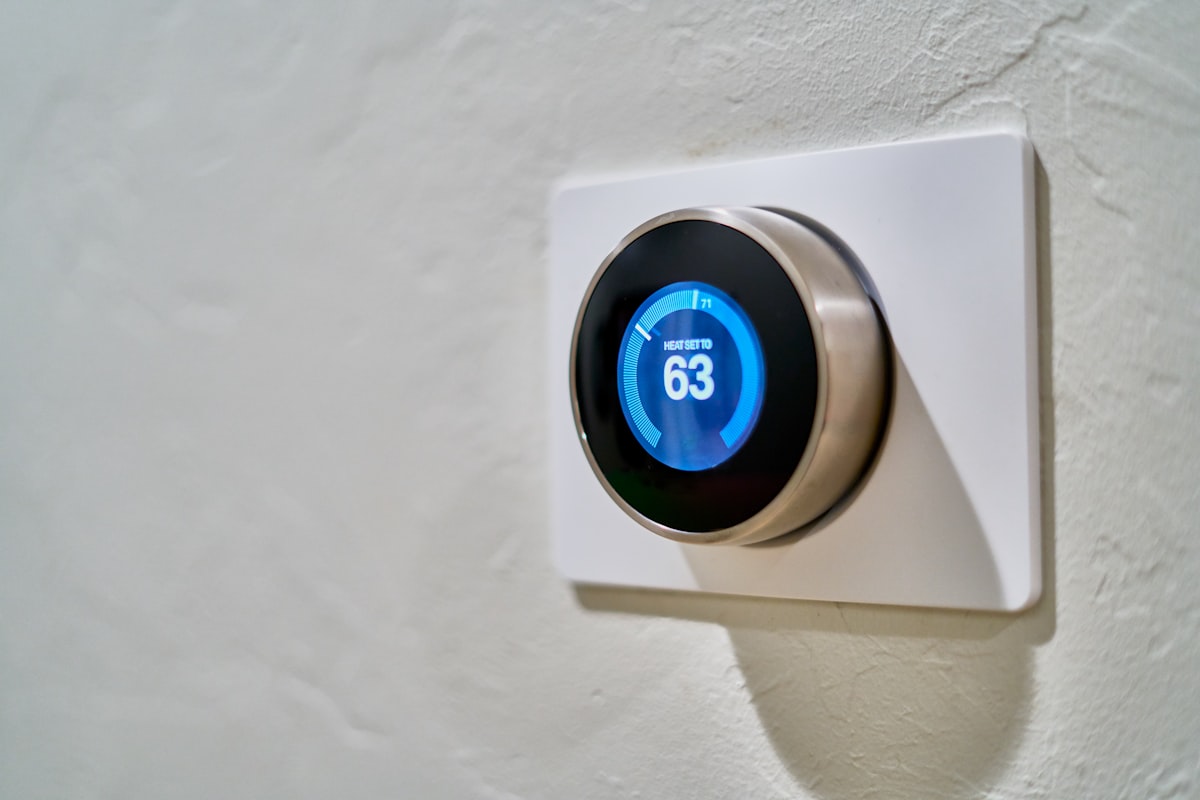 Smart heating thermostat mounted on a wall