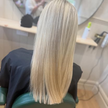 Sleek blonde blow-dry finish, straight and glossy