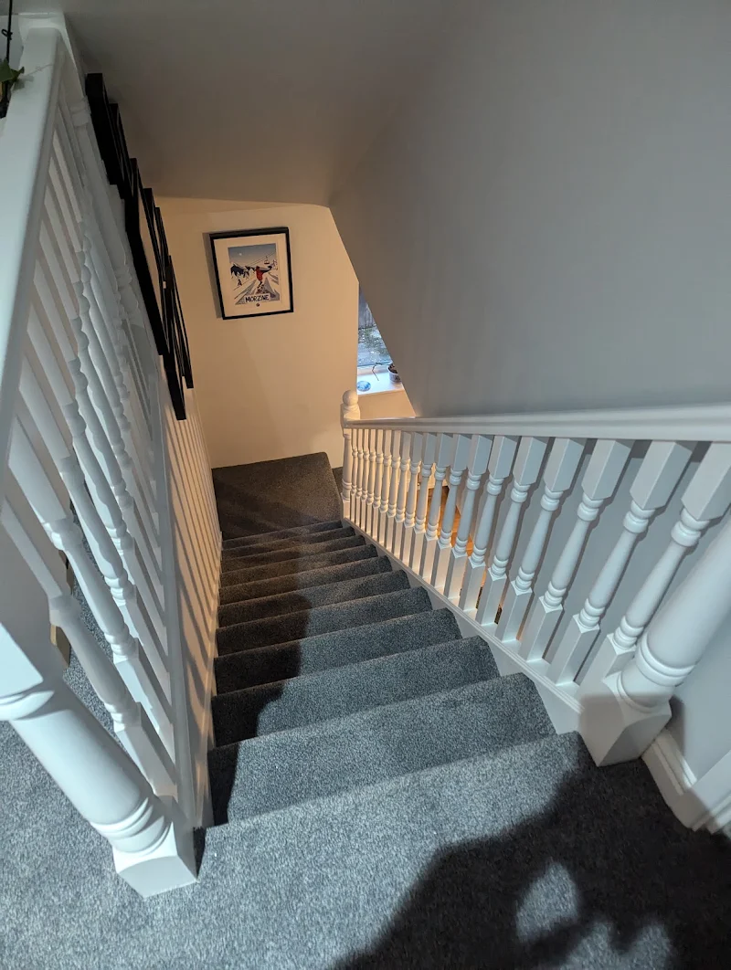 Painted staircase spindles and handrail viewed from above