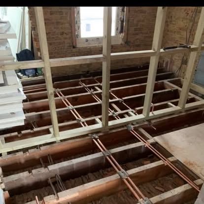 First-fix heating pipework and studwork in a house renovation