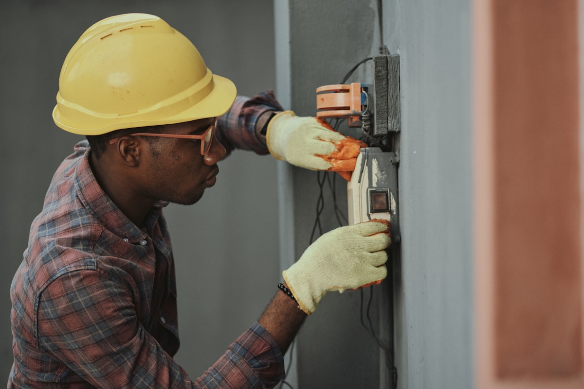 Gas engineer carrying out a safety check on a home appliance