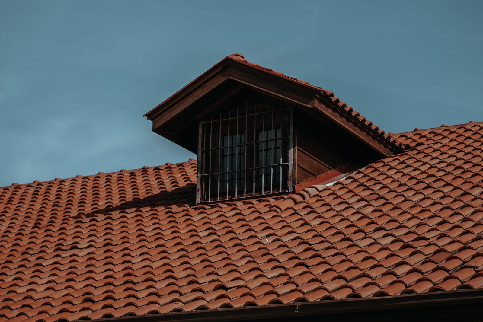 Re-tiled pitched roof with an attic window
