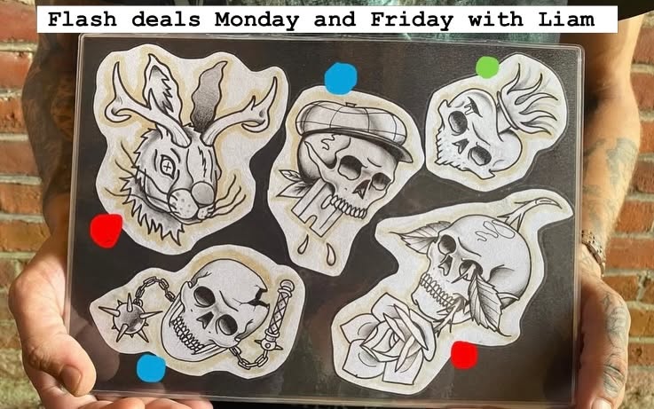 Hand-painted flash sheet artwork of a rabbit and skull designs, photographed at Tattoo Magic studio