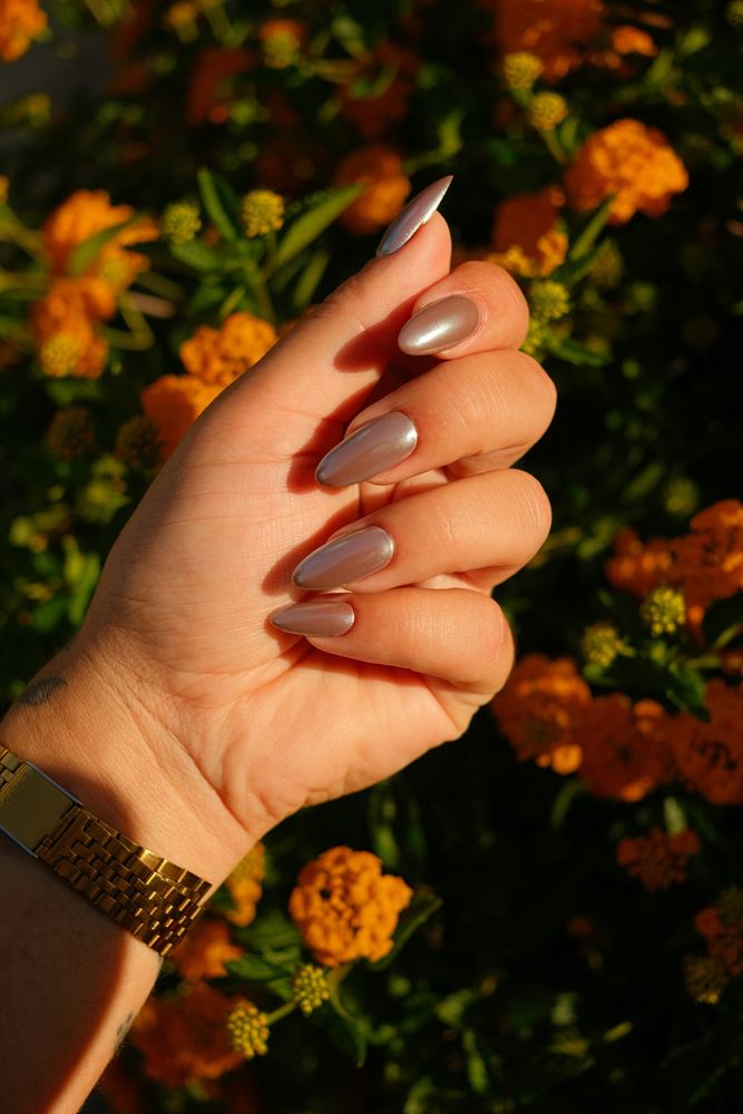 Long almond nails with a mirrored silver chrome finish