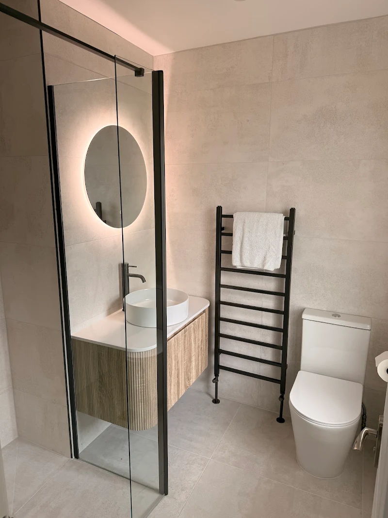 Modern bathroom refit with walk-in shower, LED mirror and wood vanity