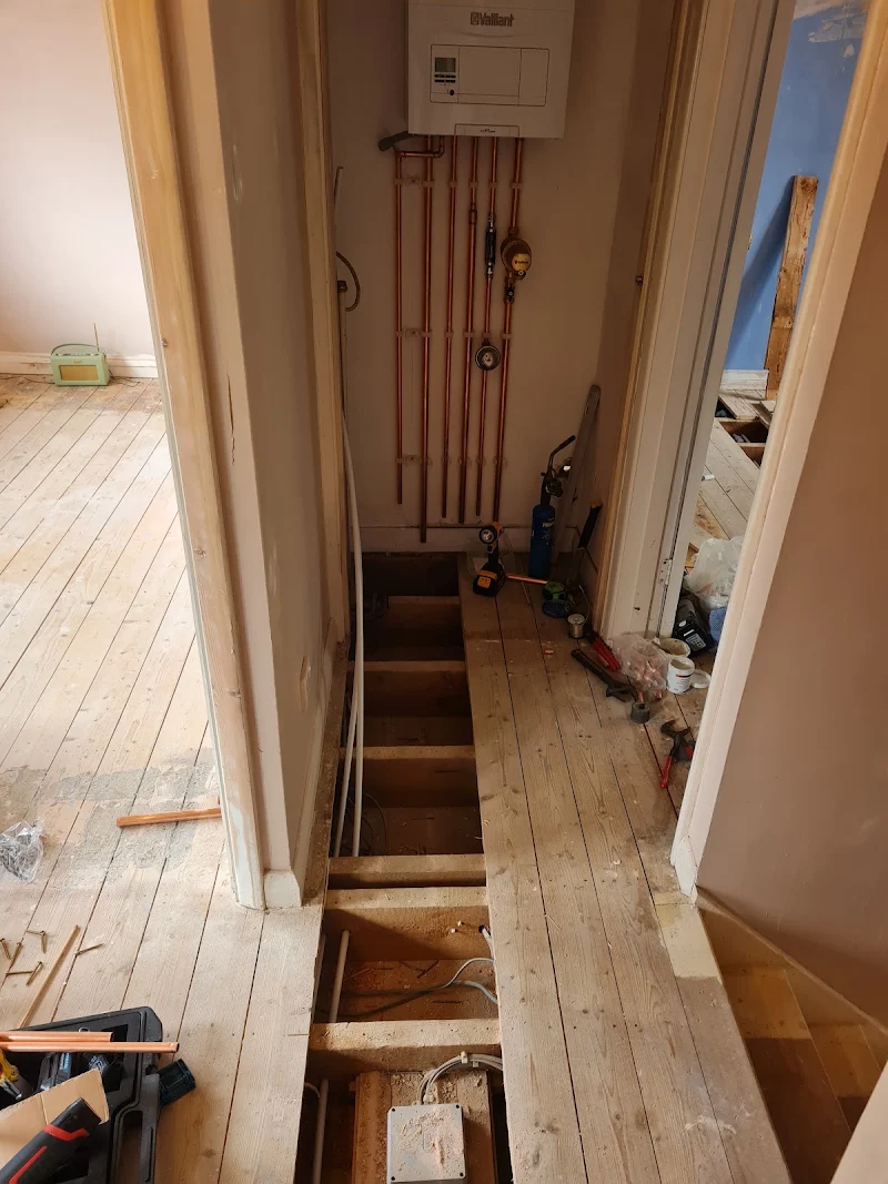 Boiler with neatly run copper pipework during a heating installation by TJ Plumbing