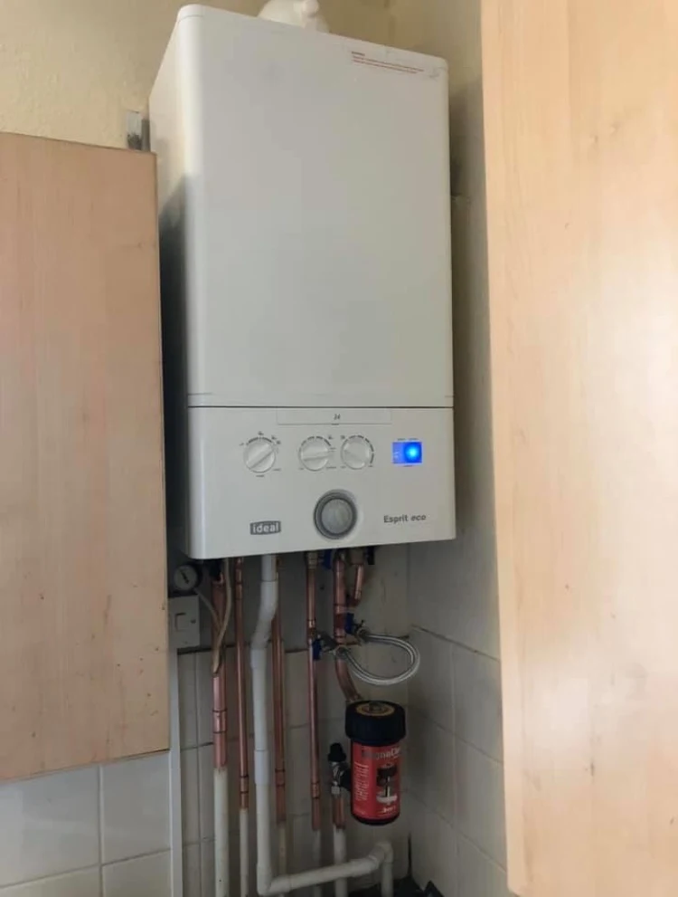 New Ideal boiler installed between kitchen units