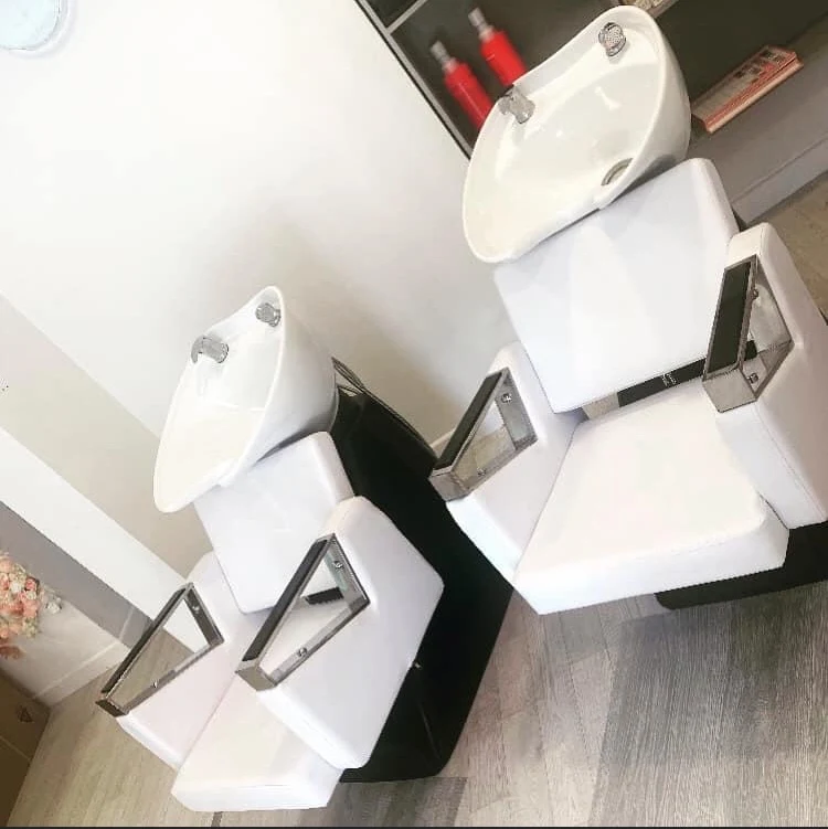 Two backwash basin units plumbed in at a hair salon