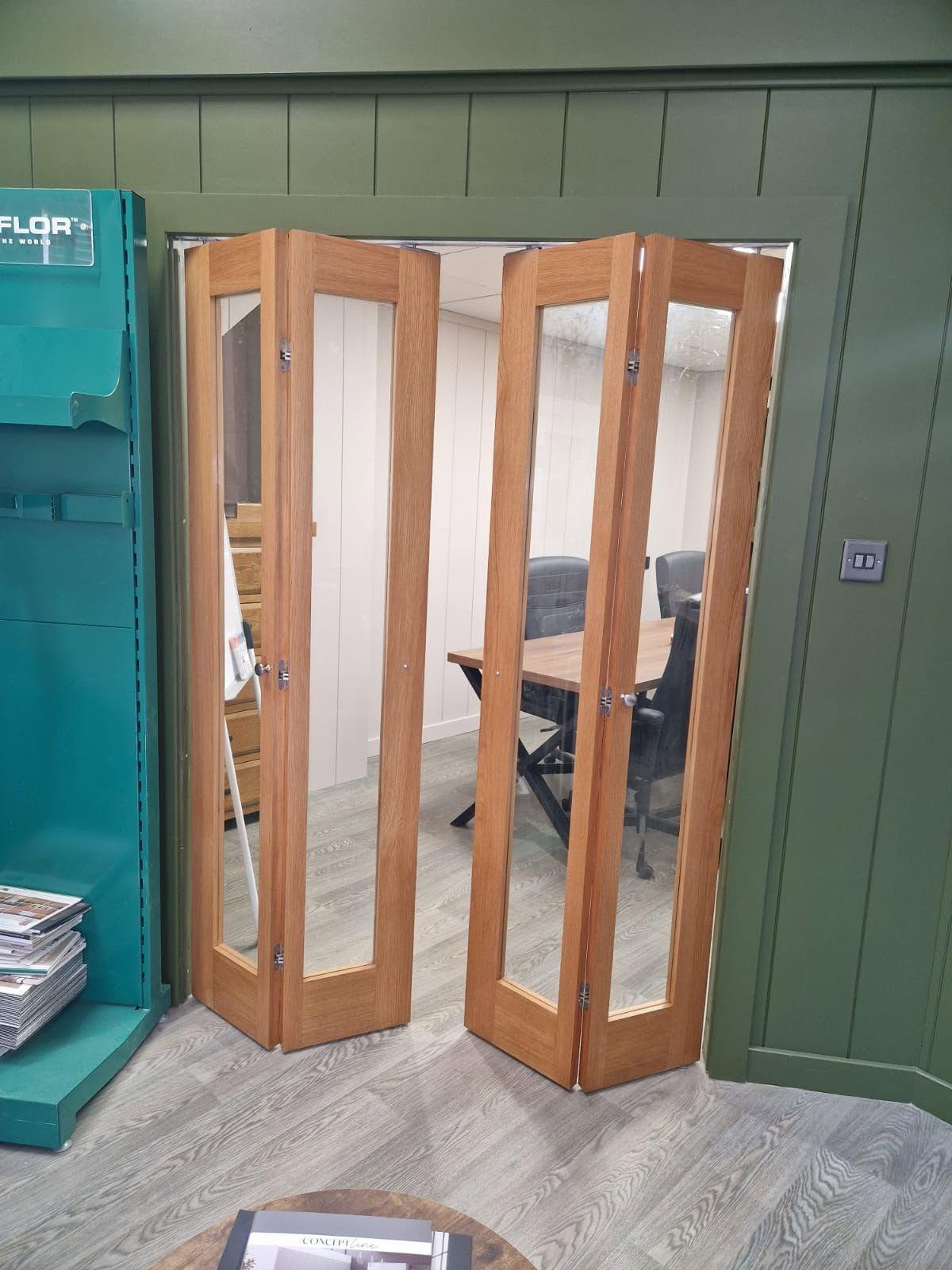 Oak-framed glazed bi-fold doors opening onto a meeting room