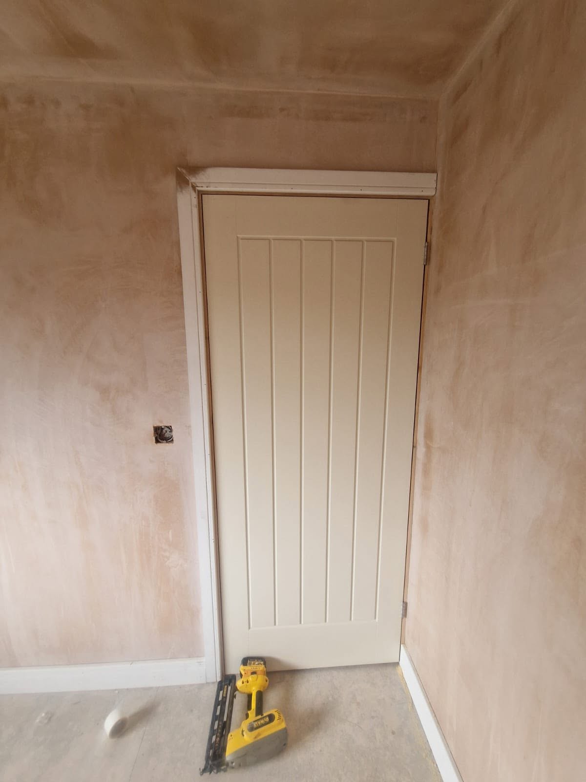 Carpentry and second-fix work in a replastered room