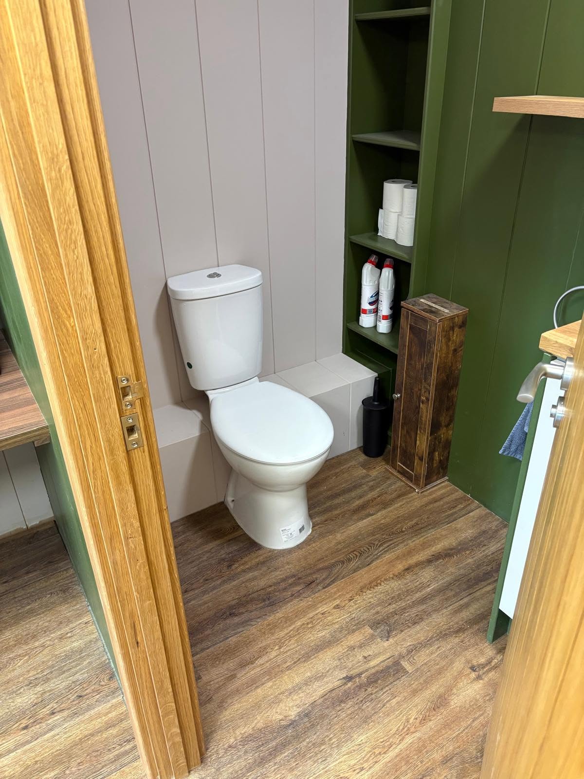 Refurbished washroom with new sanitaryware and vinyl flooring