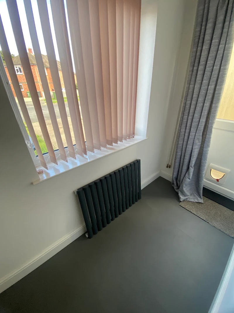 Radiator installed beneath a window