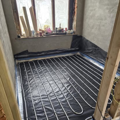 Underfloor heating pipework laid ready for screed